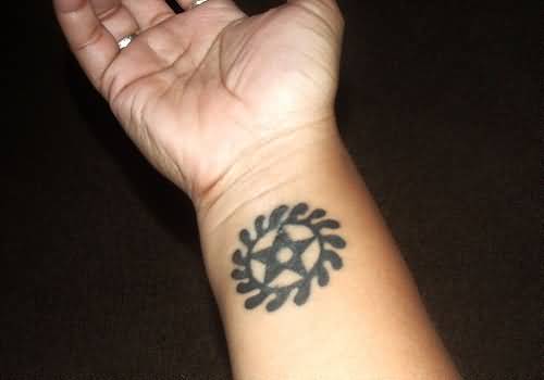 Simple Nice African Sesa Wo Suban Symbol Tattoo On Wrist